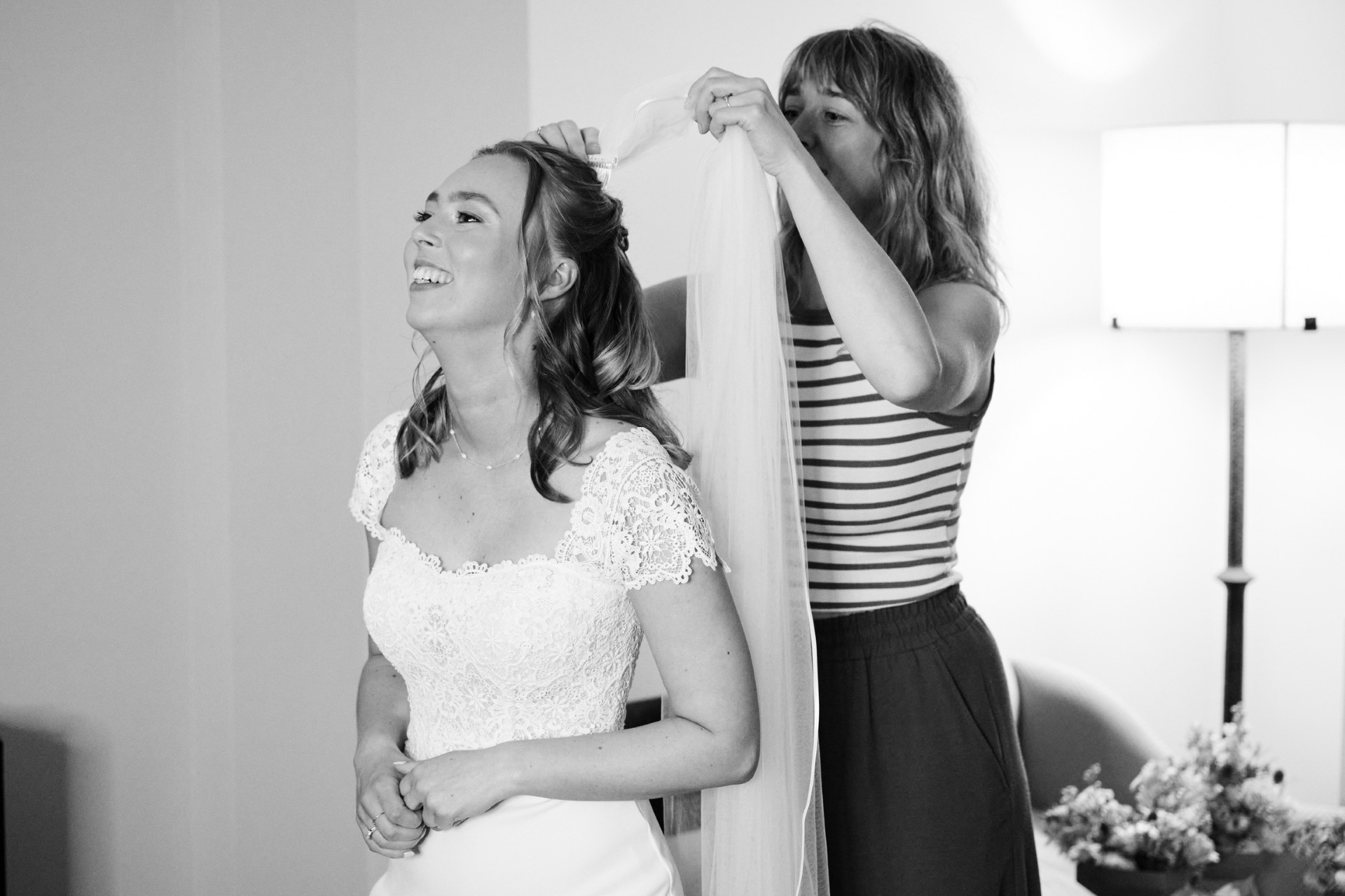 Hannah styling a bride's hair on the wedding morning